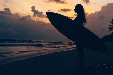 surf girl at the sunset