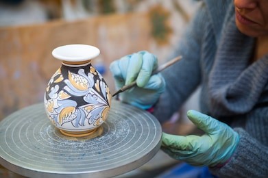 view of a ceramic vase from caltagirone being decorated by a local artisan