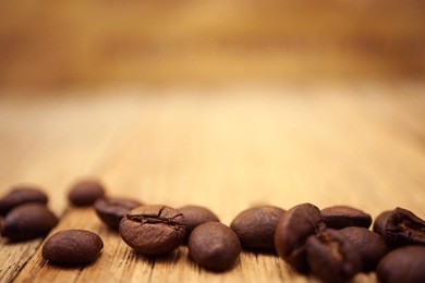 coffee with coffee beans wooden table