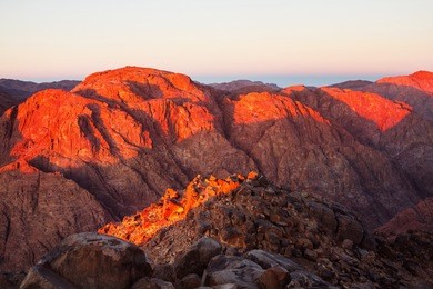 a view of orange morning sunrise at the top of moses mountain