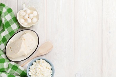 dairy products on wooden table. various cheese. top view with copy space