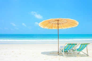 blue sea and white sand beach with beach chairs and parasol, samed island, thailand - holiday and vocation concepts