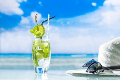 mojito cocktail with fresh lime at the beach