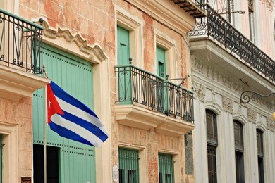 street in havana with cuba flag