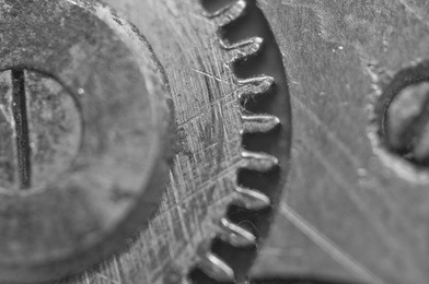 background with metal cogwheels in old clockwork. conceptual black and white photo for your successful business  workflow . macro