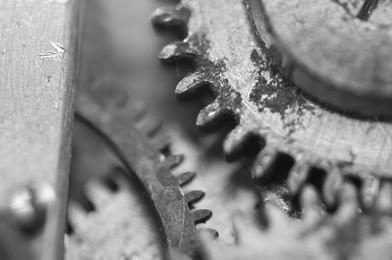 background with metal cogwheels in old clockwork. conceptual black and white photo for your successful business  workflow . macro