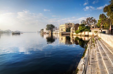 lake pichola and hotels at blue sky in udaipur, rajasthan, india