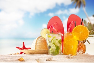 summer beach with accessories. blur azure sea on background