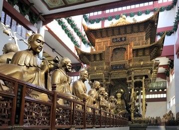hall with statues at lingyin temple, hangzhou, shandong province, china focused at left statue