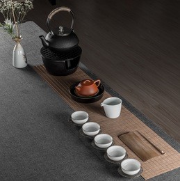 asian tea set with pink flower and towels