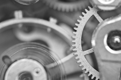 macro, black white background with metal cogwheels a clockwork. conceptual photo for your successful business design