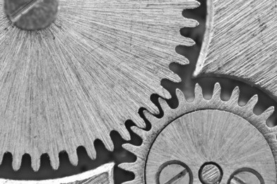 macro, black white background with metal cogwheels a clockwork. conceptual photo for your successful business design
