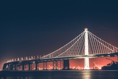 oakland bay bridge at night. san francisco - oakland, california, united states.