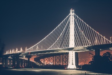oakland bay bridge during night hours. oakland bridge illumination.