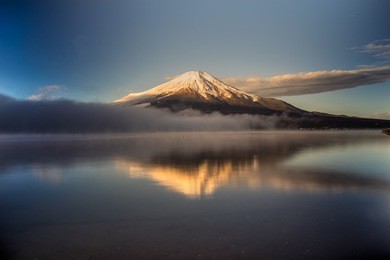 mount fuji reflected in lake yamanaka at dawn, japan.
