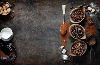 top view of three different varieties of coffee beans on dark vintage background