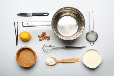 food ingredients and kitchen utensils for cooking isolated on white