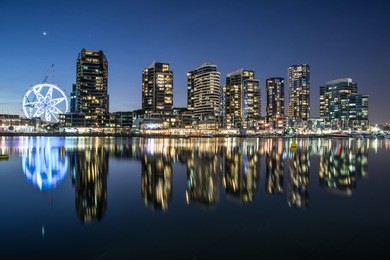 the reflection of docklands waterfront area in melbourne at night, australia.