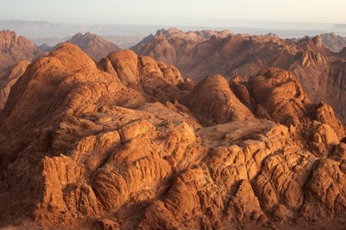 panorama rocks of holy ground mount sinai in early morning  "and the mountains shall be molten under him, and the valleys shall be cleft, as wax before the fire..." micah 1:4