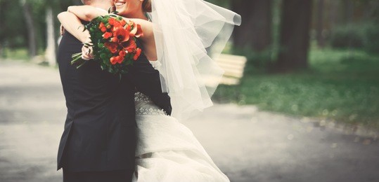 summer picture of happy wedding couple outside. 