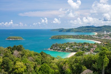 beautiful turquoise ocean waves with boats and coastline from high view point. kata and karon beaches phuket thailand