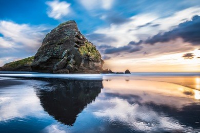 taitomo island, piha beach, auckland, new zealand