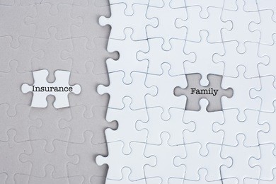 puzzle with insurance and family for protection concept
