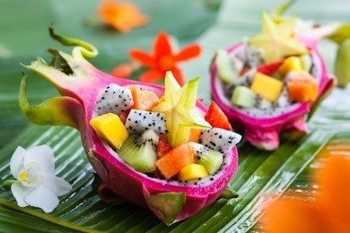 exotic fruit salad served in half a dragon fruit