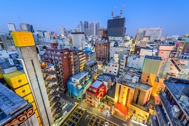 shinjuku, tokyo, japan cityscape at twilight overlooking kabuki-cho "love hotels."