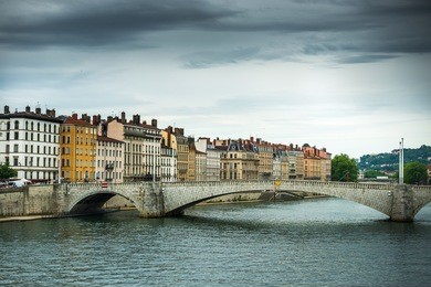 view from river sona to the bonaparte bridge and lyon city, france