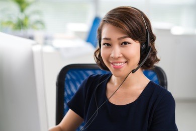 portrait of pretty smiling woman in headset