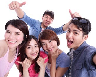 selfie - happy teenagers taking pictures by themselves isolated on white background, asian