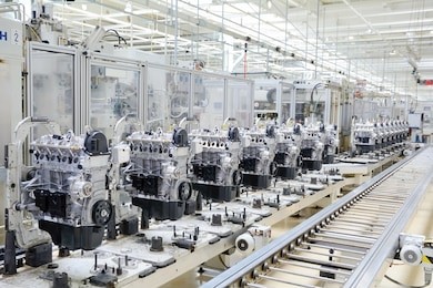 production line for manufacturing of the engines in the car factory. car factory. car parts. engine factory. new engine factory. engines on line.
