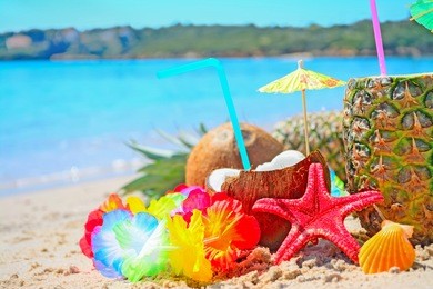 pineapple and coconuts by the shore in sardinia