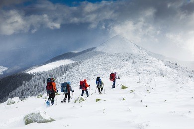 people hiking in beautiful mountain nature landscape
