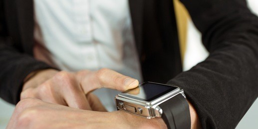 businesswoman using a smart watch shot in studio