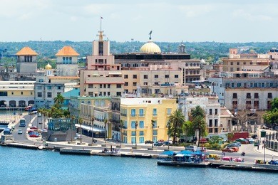 view of old havana with beautiful old buildings along the bay