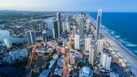 gold coast beautiful panorama aerial view of surfers paradise city skyline cityscape with light trails from q1 building at dusk in summer sunset, australia