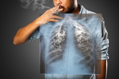 man smoking with x-ray lung, isolated on grey background