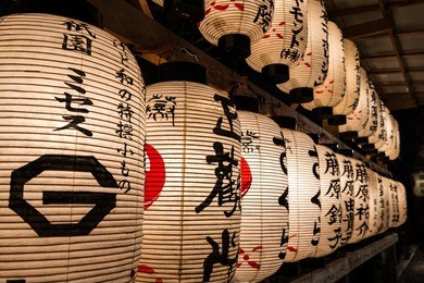 paper lanterns wish visitors a happy new year at yasaka shrine in kyoto, japan.
