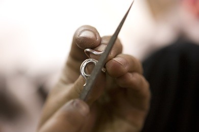 varanasi, india - may: unidentified jeweler making jewelry (ring). handwork. may 15, 2015 in varanasi, india. according to legend, varanasi was founded by lord shiva