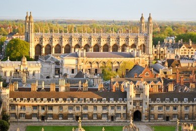 panoramic aerial view of historical buildings in cambridge, as seen from the tower of st. john's college right before the sunset.