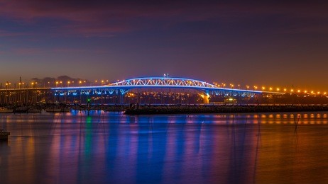 auckland harbour bridge lit up at night