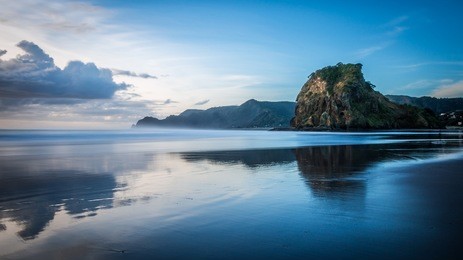 lion rock, piha beach in auckland, new zealand