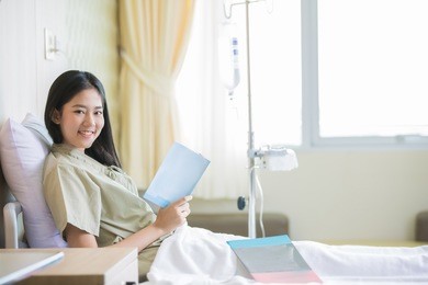 patients women in patient rooms she was reading a book relaxation