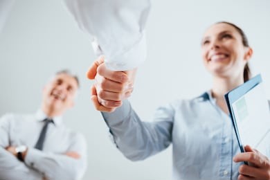 confident business people shaking hands and woman smiling, recruitment and agreement concept
