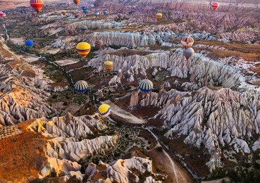 hot air balloon flying over rock landscape at cappadocia turkey