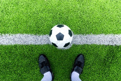 soccer player ready to play at kick off point in soccer field. 