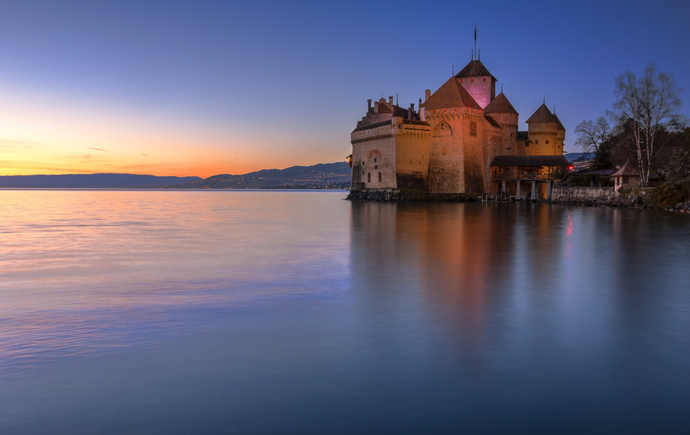 the castle of chillon, a 13th-century castle on the shore of lake geneva, situated only 3 km south of montreux, switzerland and is one of the best preserved medieval castles in europe.