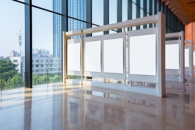 blank panel stands along the modern exhibition hall